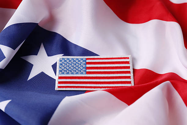 istock Veterans day. USA army patch on American flag 2215887335