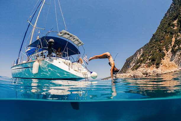 istock Beautiful woman jumping into sea 2/3 2215902097