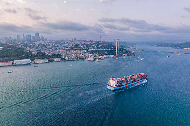 istock Large Container Ship Sailing Under Bridge in Scenic Coastal City. Istabul, Turkey. Bosphorus. Drone 2215905340