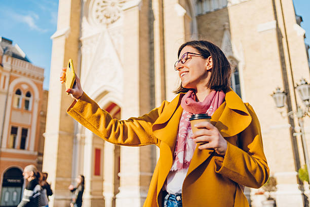istock A young woman enjoys taking selfies and video calling 2215906505