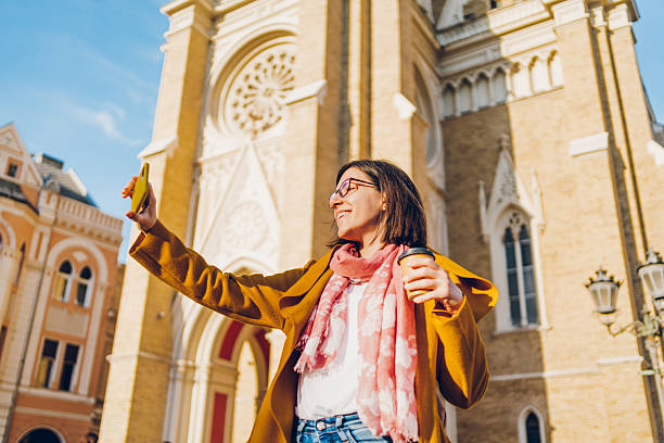 istock A young woman enjoys taking selfies and video calling 2215906722