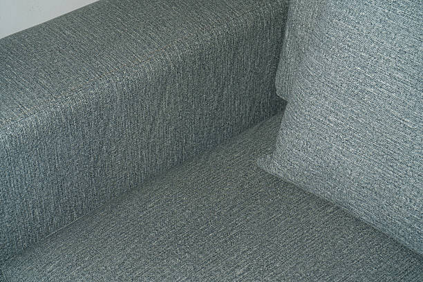 istock Blue fabric texture with white leather sofa in the background 2215907392