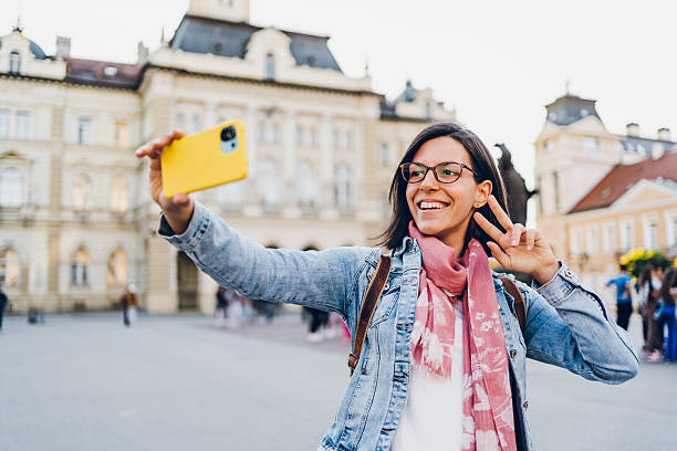 istock A young woman using phone in the city 2215907594