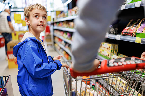 istock Carefree Child Having Fun While Shopping 2215910075