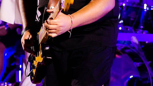 istock Playing electric guitar with ambition and concentration 2215910108