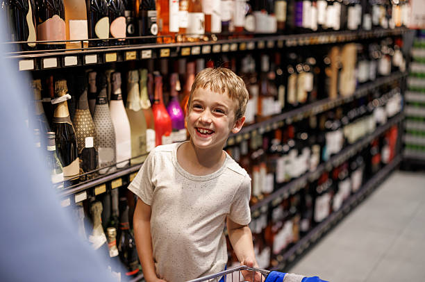 istock Smiling Boy Enjoying Shopping Trip with Father 2215911895