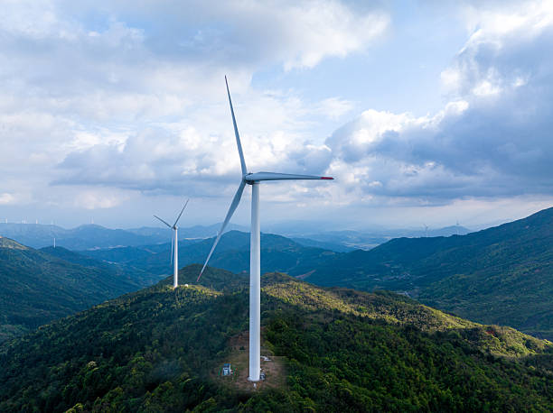 istock Sunset, clouds and wind farms 2215912770
