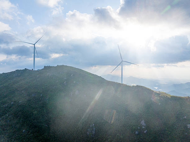 istock Sunset, clouds and wind farms 2215912841