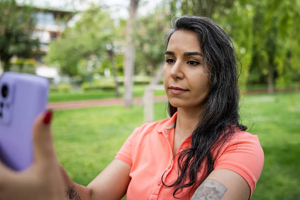 istock Iranian woman is taking selfie in nature. 2215913825