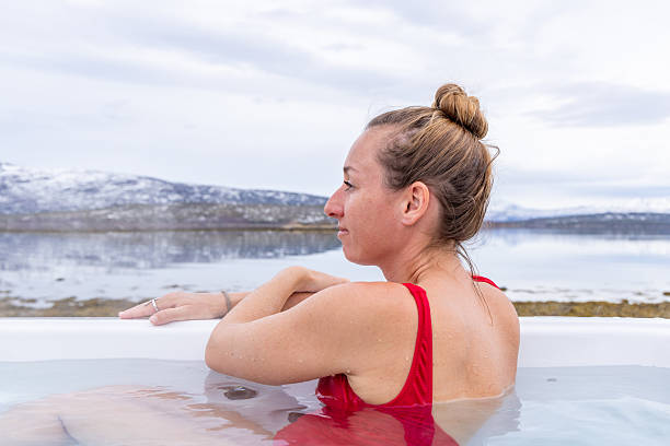 istock Woman Immersed in Nature at a Mountain Hot Spring 2215913836