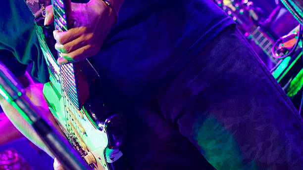 istock Low angle view of electric guitar and guitarist 2215914552