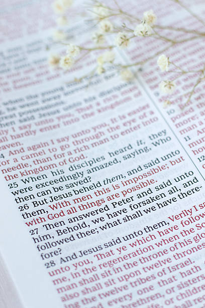 istock With God all things are possible, biblical text in open holy bible book 2215916381
