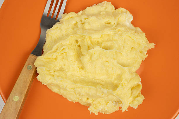 Mash, potato and food on table for dinner, supper or dish for event, lunch or meal at a party. Vegetable, plate and bowl closeup with healthy nutrition, mashed potatoes and herbs on serving of salad