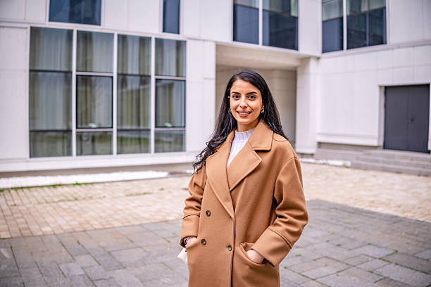 istock Successful businesswoman standing outdoors in a professional setting, exuding confidence and elegance in her attire 2215917830