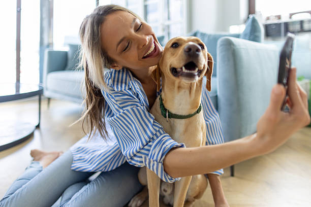 istock Beautiful young woman and her dog 2215918208