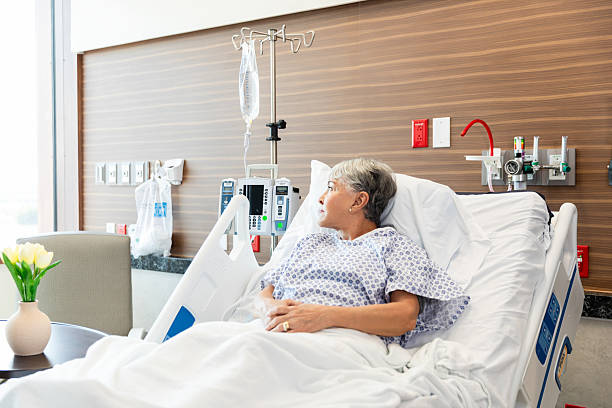istock Senior Woman in Hospital Bed, Contemplative Expression 2215918558