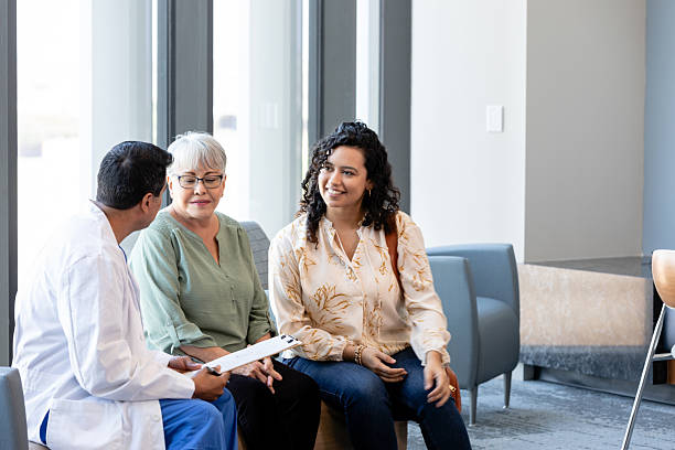 istock Doctor Discussing Treatment Plan with Two Female Patients 2215918598