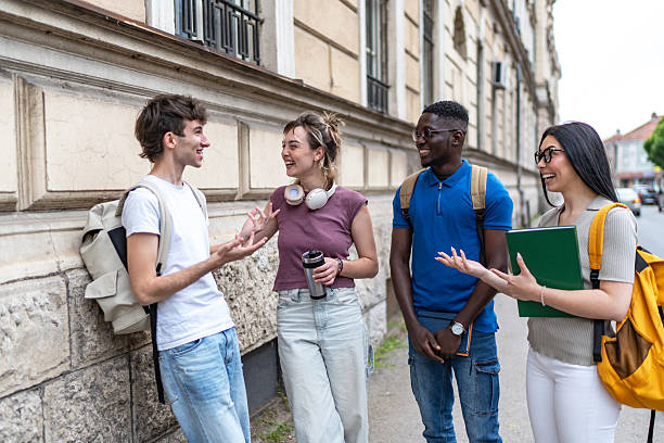 istock Cheerful multi-ethnic students chatting together on campus after class 2215919188