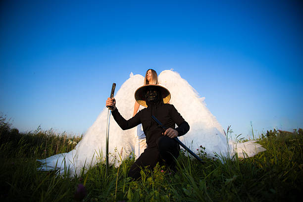 Woman holding nunchakus.