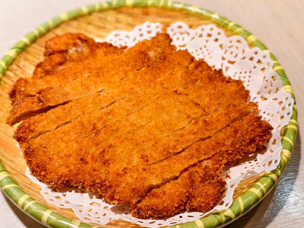 Chinese-Style Crispy Fried Pork Cutlet on Bamboo Plate