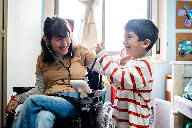 istock Child boy playing with his mother with a stethoscop at home 2215919879