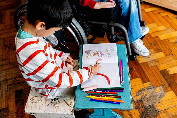 istock Child boy painting or drawing at home 2215920516