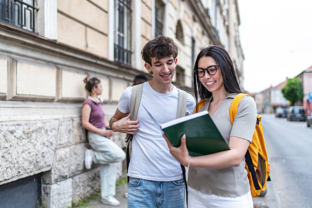 istock Young adults studying together outdoors 2215920670