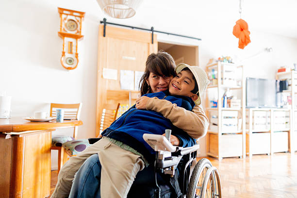 istock Child boy embracing his mother at home 2215920671