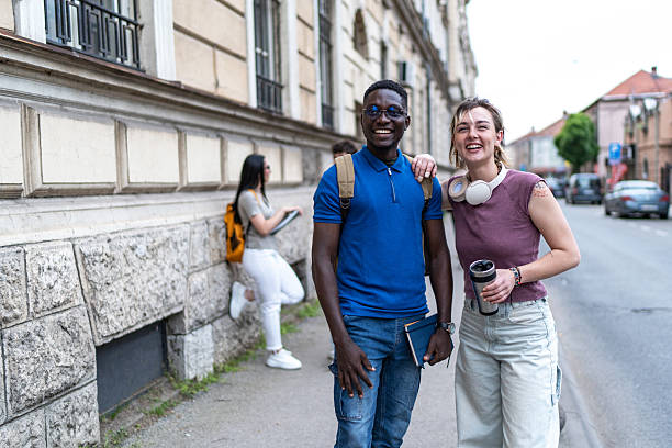 istock University students smiling and walking in the city 2215920757