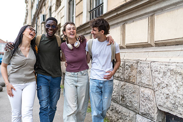istock Young adults enjoying a laughter-filled stroll together 2215921327