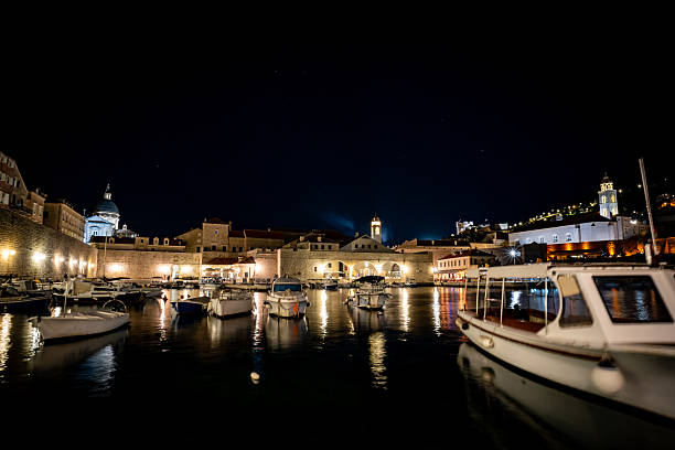 istock Boats moored in old Dubrovnik Harbour at night 2215926497