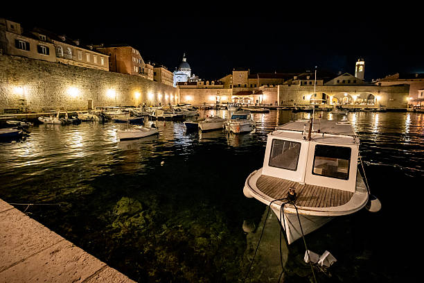 istock Boats moored in old Dubrovnik Harbour at night 2215926512