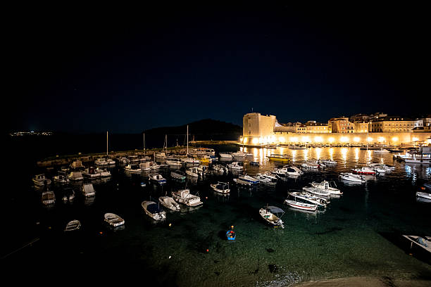 istock Boats moored in old Dubrovnik Harbour at night 2215926557