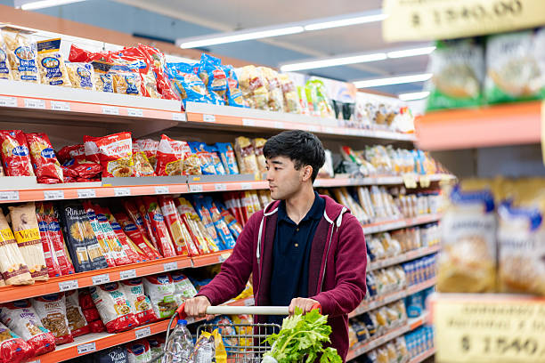 istock Japanese man shopping in modern grocery store 2215927746