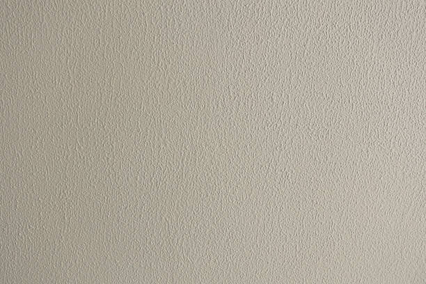 istock Rough beige background, plaster texture on the wall 2215928804