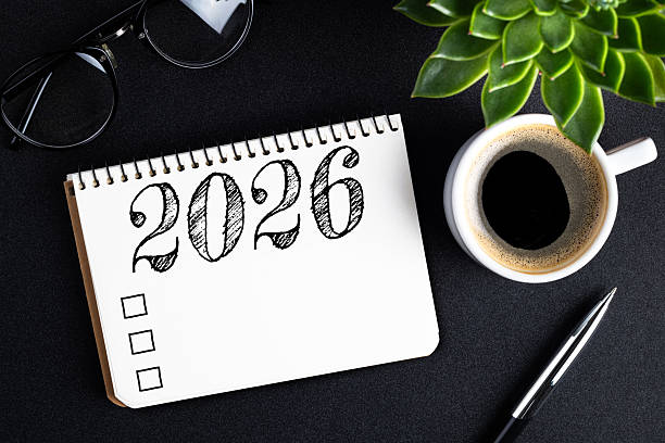 istock 2026 New year resolutions on desk. 2026 goals list with notebook, coffee cup, plant on black table. Resolutions, plan, goals, action, checklist, idea concept. New Year 2026 resolutions 2215930800