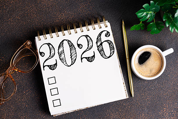 istock New year resolutions 2026 on desk. 2026 goals list with notebook, coffee cup, plant on table. Resolutions, plan, goals, action, checklist, idea concept. New Year 2026 resolutions 2215930835