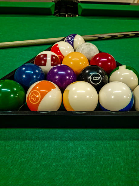 istock A set of billiard balls arranged in a triangle on a green pool table cloth 2215932901