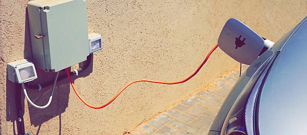 istock Electric Car Charging Close Up Daylight Beige Modern Technology 2215933476