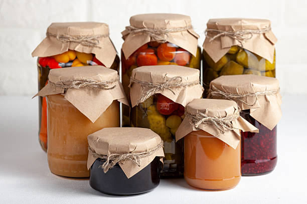 istock Assorted homemade preserves and pickles in rustic jars 2215934380