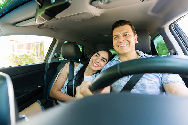 istock Smiling couple enjoying a relaxing car ride 2215935441