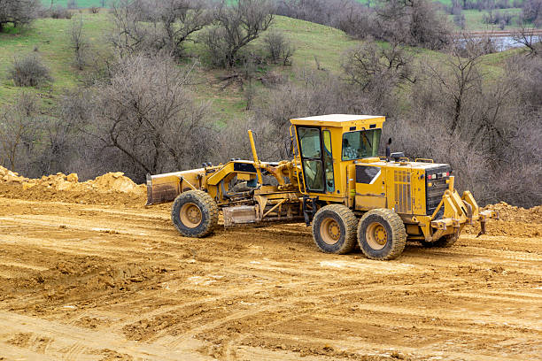 istock Motor grader on a construction site. Road construction. Leveling the road 2215936819