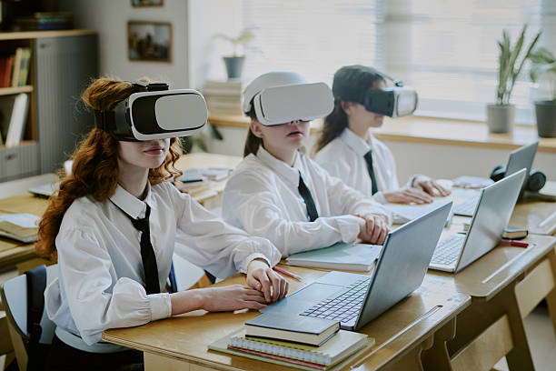 istock Students Wearing Virtual Reality Headsets in Classroom 2215937352