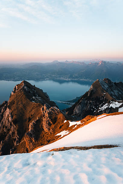 istock Sunrise over lake and mountain ranges from mountain peak 2215939228