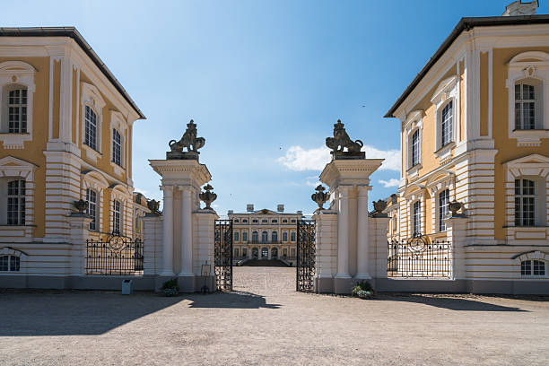 Rundale, Latvia -July 21, 2019: Summer view of the Rundale Palace from the time of the Russian Empire in Latvia. Baroque building under a clear blue sky and clouds. The castle houses a state-owned museum.