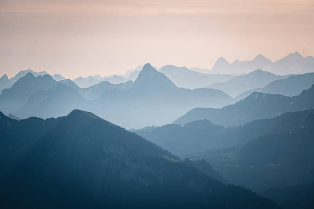 Sunrise over mountain ranges from mountain peak, Mount Grammont, Valais, Swiss Alps