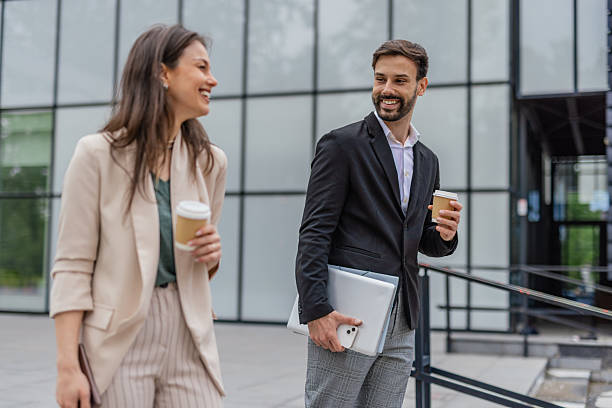 istock Smiling Business Colleagues Walking Together 2215939997