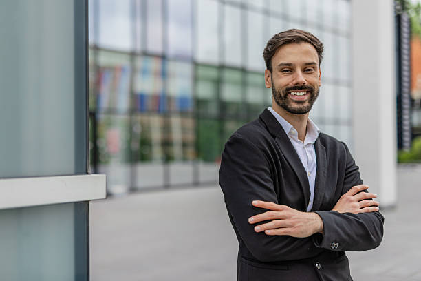 istock Confident Businessman Standing Outside Modern Office 2215940406