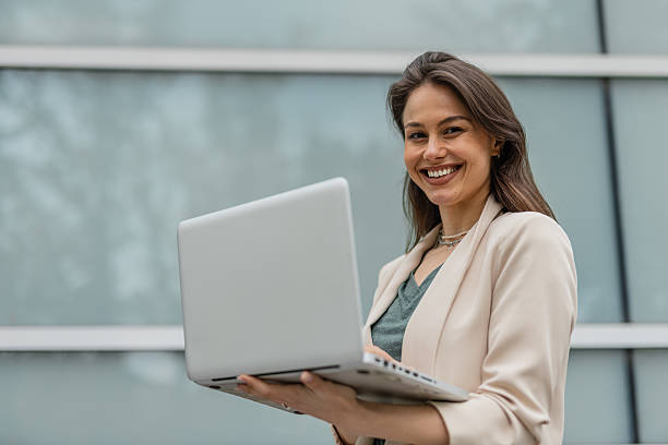 istock Cheerful Entrepreneur Working Remotely Outside Office 2215940635