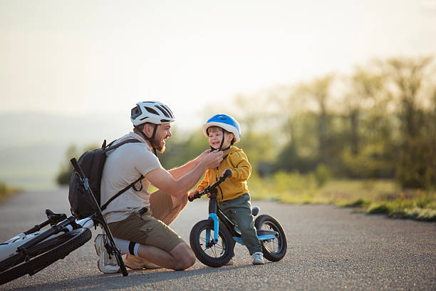 istock First helmet before bike ride! 2215940753